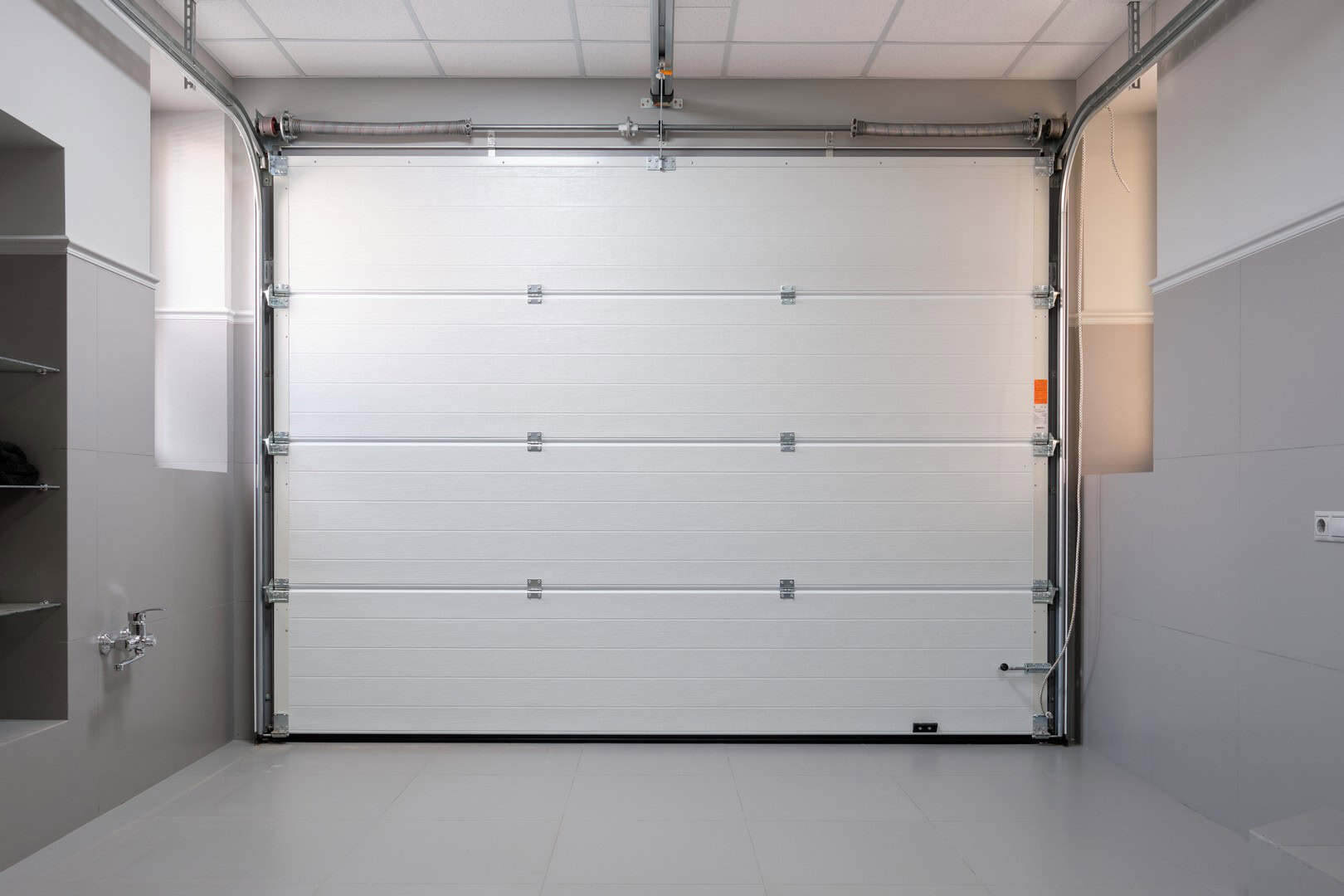 Organised garage with fitted storage cabinets